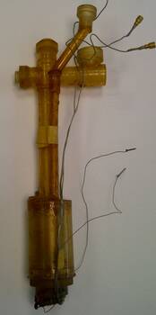 Plastic mixing chamber with conical plugs